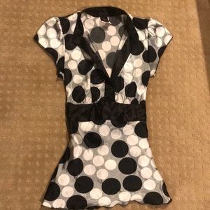 Black and white polka dot blouse.
